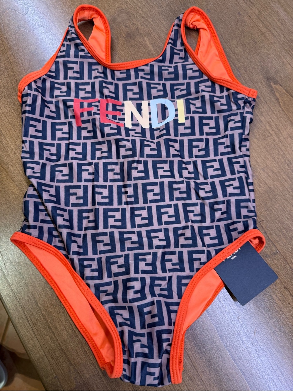Fendi Kids Navy Monogram One-Piece Swimsuit with Orange Trim and Multicolor Logo
